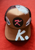SHE NEEDS BRAG K. HAT