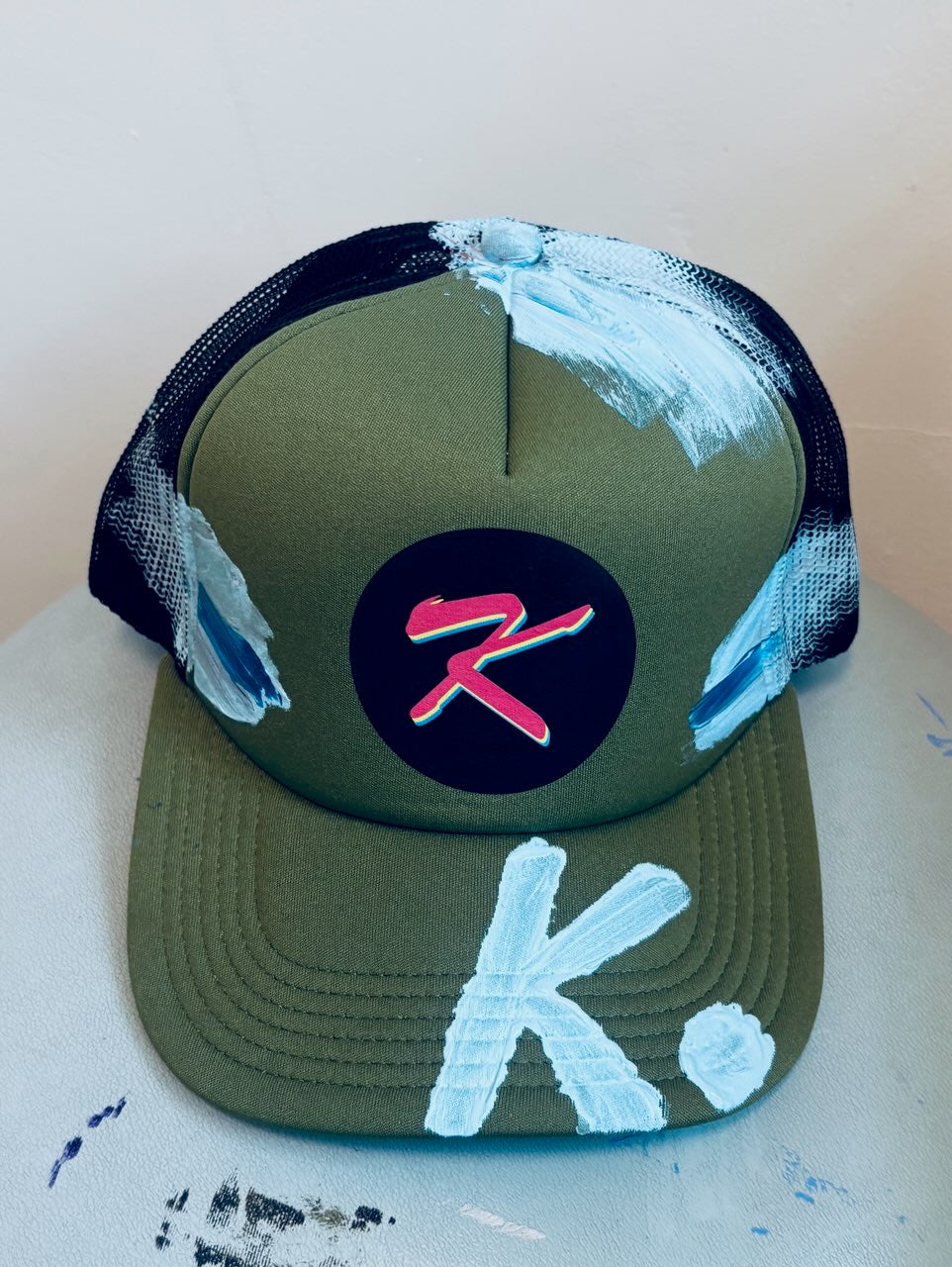 SHE NEEDS BRAG K. HAT