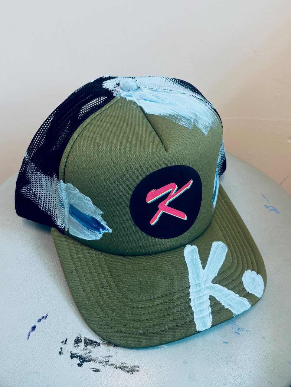 SHE NEEDS BRAG K. HAT