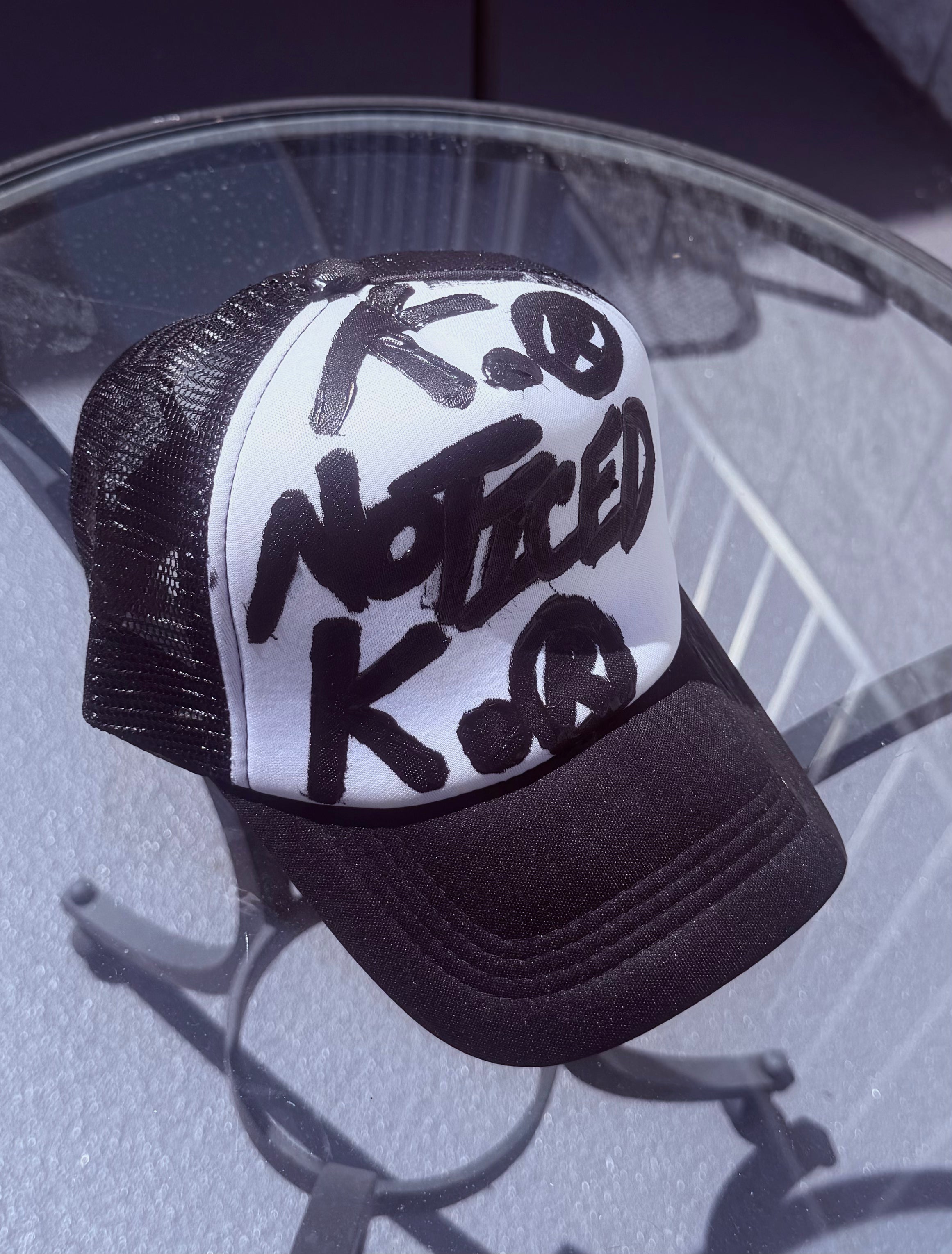 OBVIOUS BRAGGER K. HAT